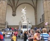 Excerpt of a video work by British artist Liane Lang. She posed a doll beneath the statue of the Rape of The Sabine Women in Florence&#39; Piazza Della Signoria and timelapsed the reaction of the public to this intervention. Her interest is in the different registers of responses that occur to the figure, how people look, touch and pose with objects in public space. Lang has also made a number of works with statues from the Socialist era, sculpture from the Rennaissance and recently with works from