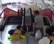 Young girl got her hand stuck in an escalator as she forgot to let go of the handrail in Hanchuan, China.