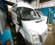 Aftermath of Police Chase Crash Damages Vans at Dealership in Wolverhampton.