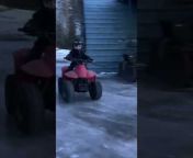 This skilled 6-year-old took his ATV for a fun ride on an icy yard. He carefully applied the throttle to pull off little drifts as he navigated between the buildings.