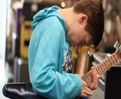 After noticing a young boy frequenting a music store just to play a special guitar, an anonymous customer bought it for him.
