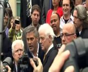 Metanews: George Clooney and his father address crowd about the Sudanese crisis before being handcuffed by police.