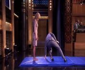 Jimmy Fallon and Heidi form a human wheel and roll through the studio before trying it German style.