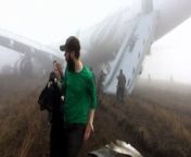 Dramatic amateur video shows passengers exiting a plane via its emergency slides, after it skidded off a runway in Nepal due to dense fog.